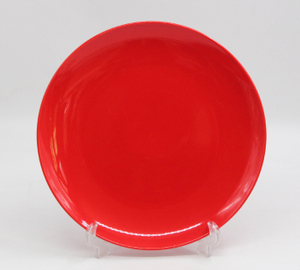 Glossy red glazed round dinner plate